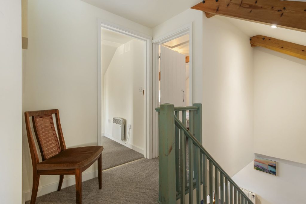 Upstairs landing and entrance to cloakroom